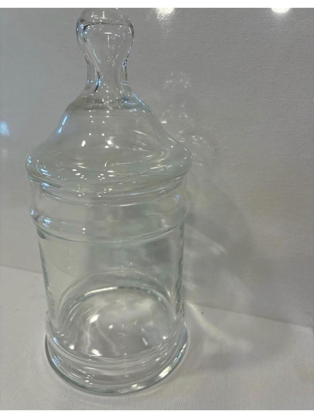 vintage-style clear glass apothecary jar with a tapered lid and a rounded knob
